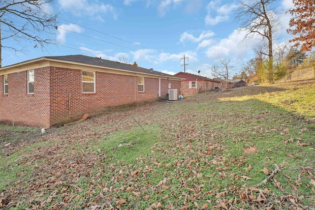 back of property featuring a yard