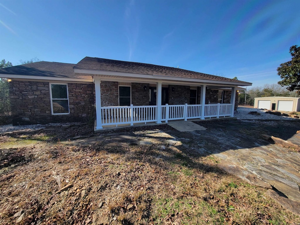 view of front of home with an outbuilding and a garage