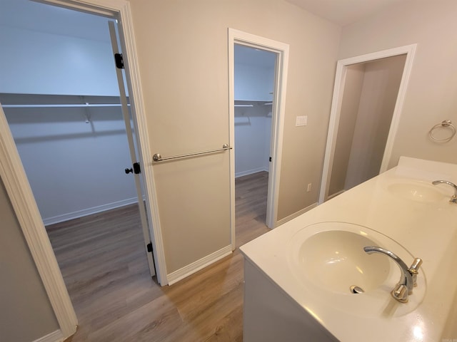 bathroom with vanity and hardwood / wood-style flooring