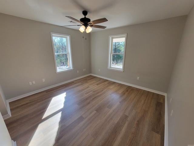 spare room featuring light hardwood / wood-style floors and ceiling fan