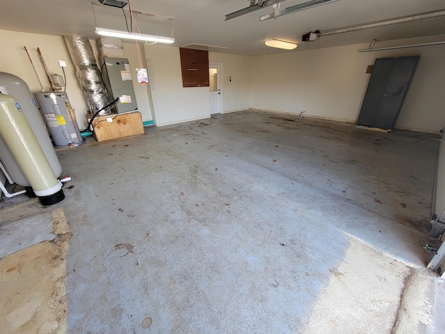 garage featuring heating unit, water heater, a garage door opener, and gas water heater