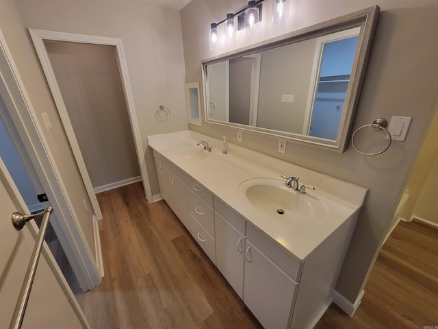 bathroom featuring vanity and hardwood / wood-style flooring