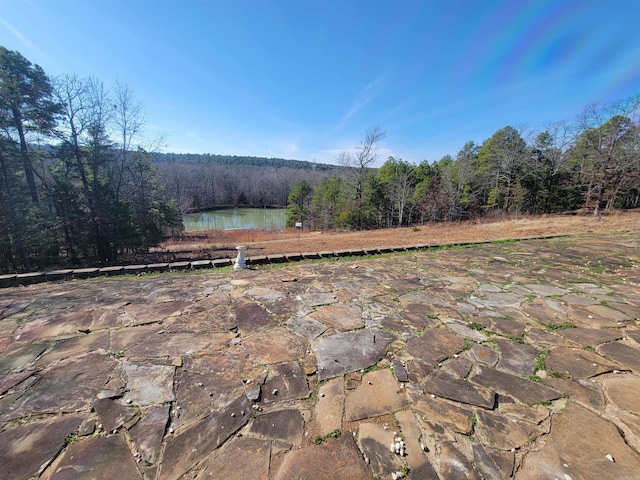 view of patio with a water view