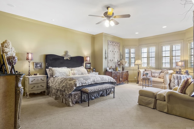 carpeted bedroom with ceiling fan and crown molding