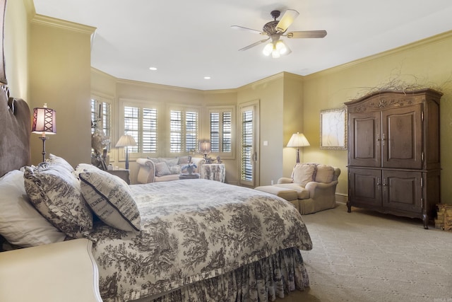 carpeted bedroom with ceiling fan and crown molding