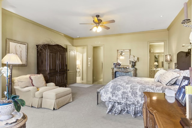 carpeted bedroom with ceiling fan, crown molding, and ensuite bathroom