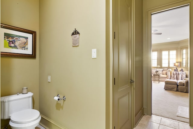 bathroom featuring tile patterned floors, toilet, and ceiling fan