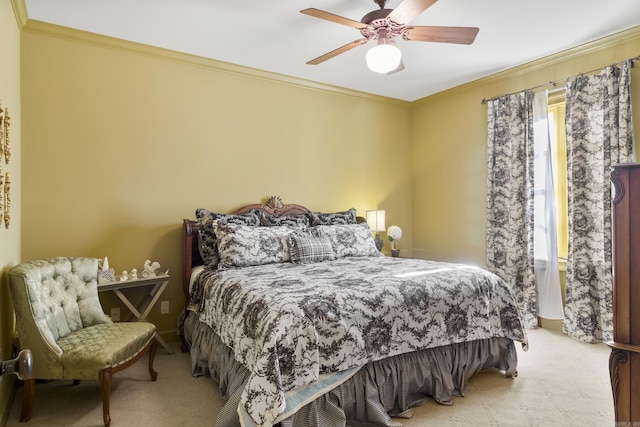 carpeted bedroom with ceiling fan and crown molding