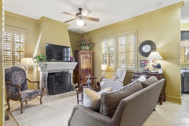 living room with ceiling fan and crown molding