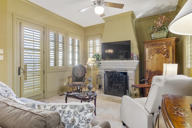 living room featuring ceiling fan and crown molding