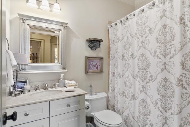 bathroom featuring walk in shower, vanity, and toilet