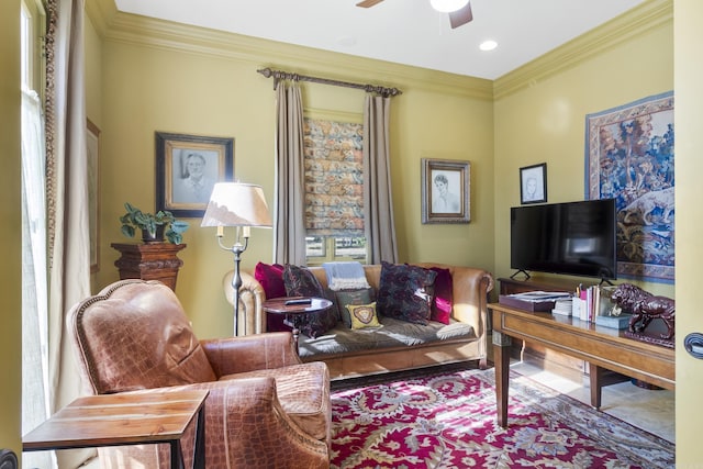 office area with ceiling fan and ornamental molding