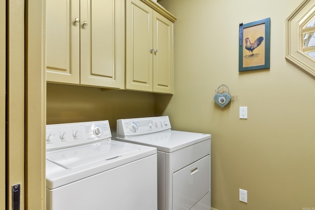 laundry area with cabinets and independent washer and dryer