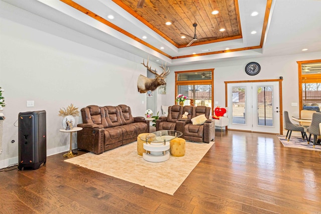 living room with a raised ceiling, wood ceiling, dark wood-type flooring, and french doors