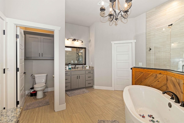 full bathroom featuring toilet, vanity, shower with separate bathtub, and an inviting chandelier