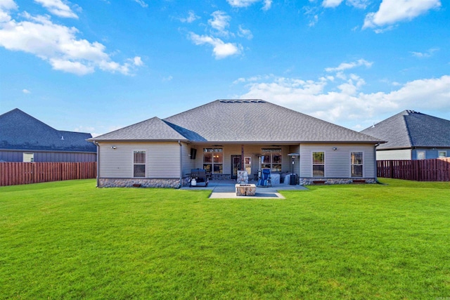 rear view of house with a lawn, a patio area, and ceiling fan