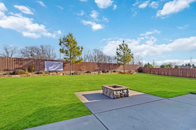 view of yard with an outdoor fire pit and a patio area