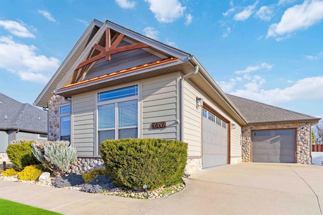 view of side of home featuring a garage