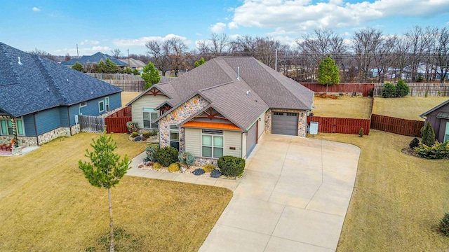 view of front of home featuring a garage and a front lawn