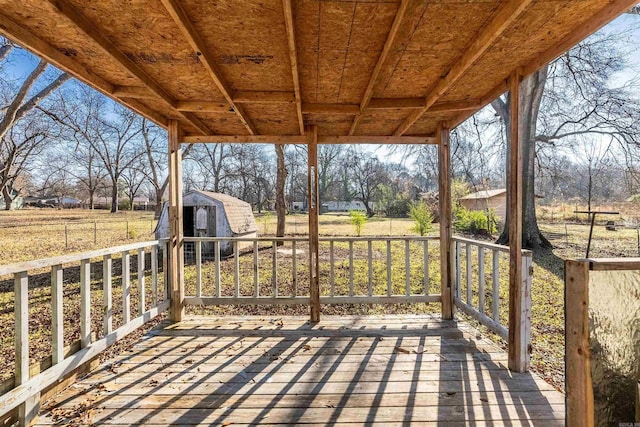 deck with a storage shed