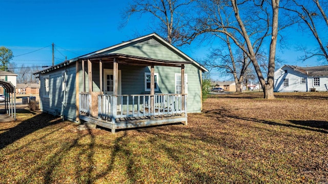 bungalow-style house featuring a front lawn and a porch