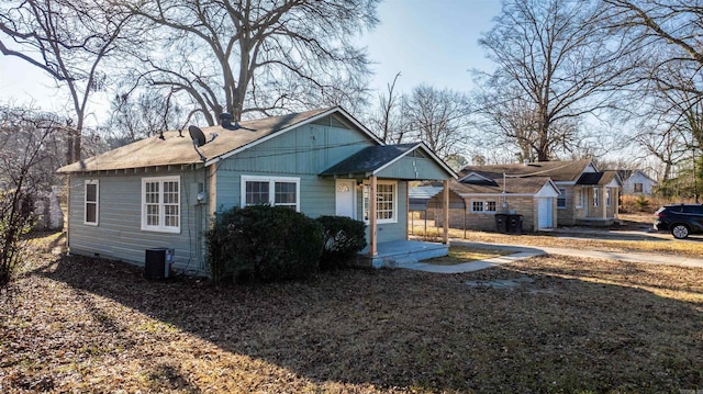 bungalow-style house featuring central air condition unit