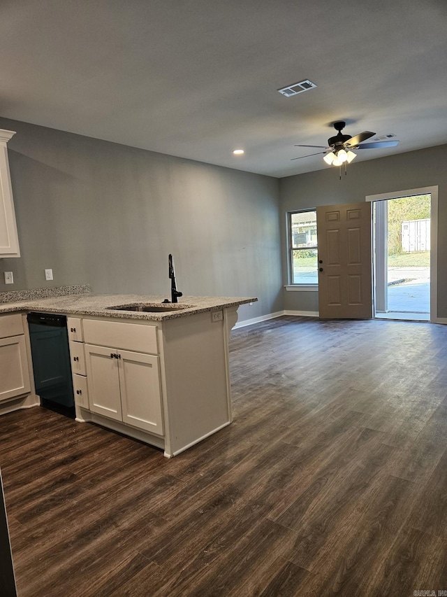 kitchen with a healthy amount of sunlight, black dishwasher, white cabinetry, and dark wood-type flooring