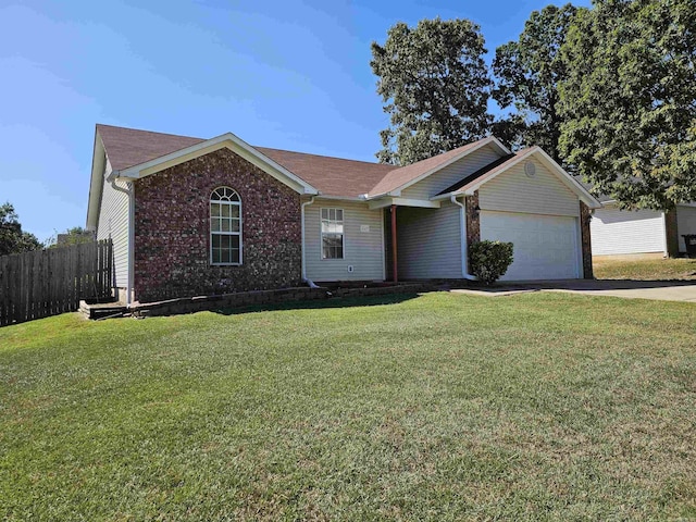 single story home featuring a front yard and a garage