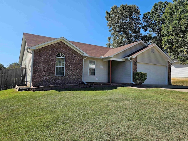 ranch-style home with a front lawn and a garage