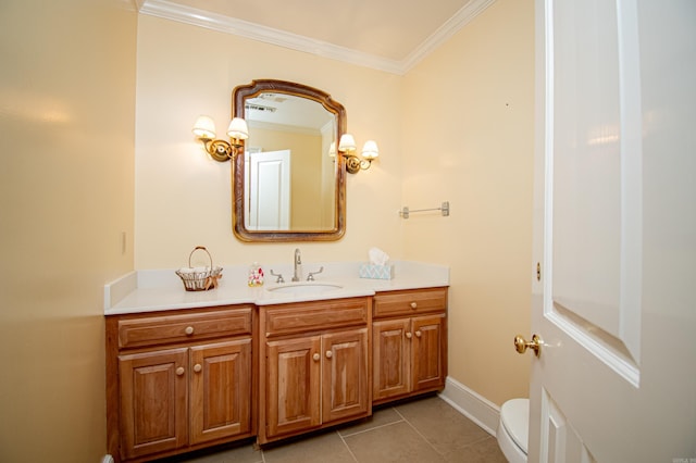 bathroom featuring tile patterned flooring, vanity, toilet, and ornamental molding