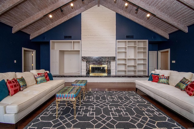 living room featuring a fireplace, rail lighting, high vaulted ceiling, and wooden ceiling