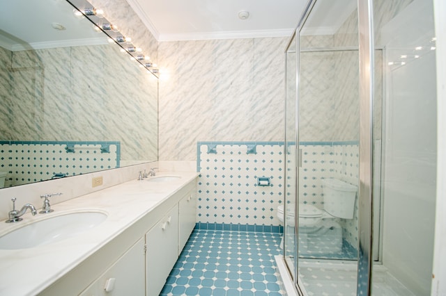 bathroom featuring vanity, toilet, an enclosed shower, and ornamental molding