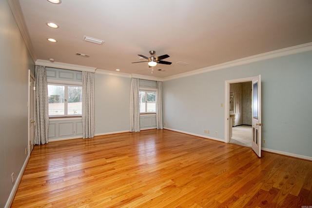 spare room with light hardwood / wood-style floors, ceiling fan, and ornamental molding