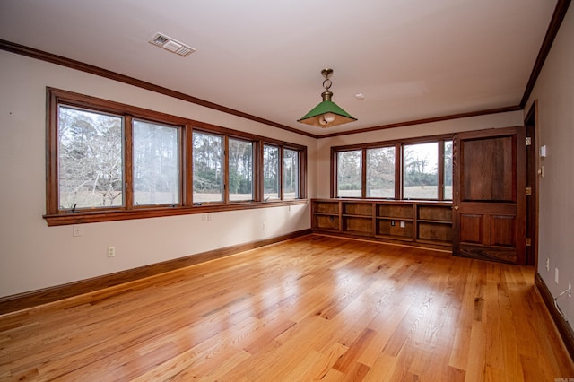 interior space featuring light hardwood / wood-style flooring and ornamental molding