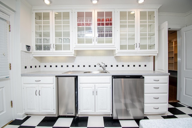 kitchen featuring crown molding, sink, white cabinets, and stainless steel dishwasher