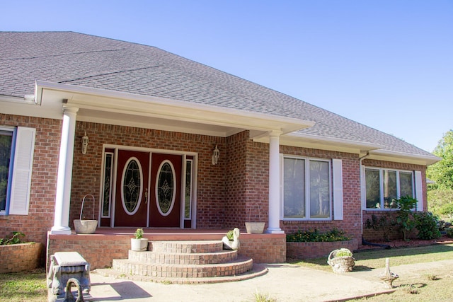 doorway to property with covered porch