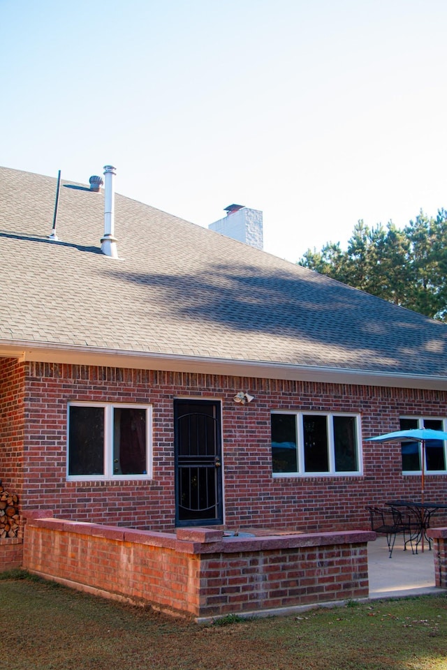 rear view of property featuring a patio area