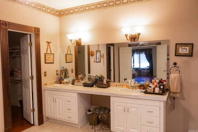 bathroom with tile patterned floors and vanity