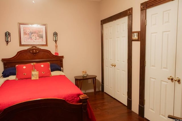 bedroom featuring dark hardwood / wood-style floors and a closet