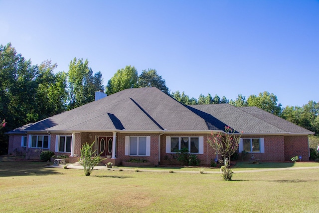 single story home featuring a front lawn