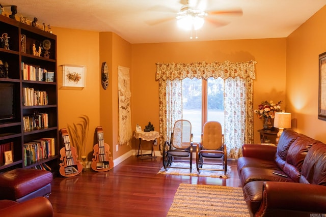 sitting room with dark hardwood / wood-style flooring and ceiling fan