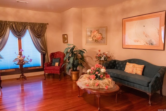 living area with hardwood / wood-style flooring