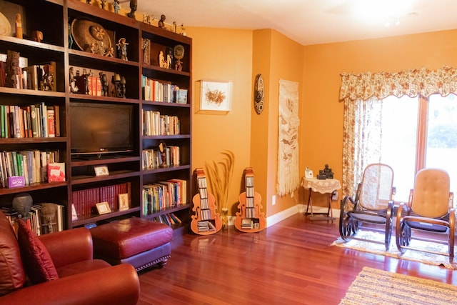 living area with wood-type flooring