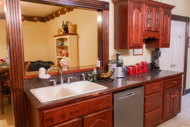 kitchen with dishwasher, light tile patterned floors, and sink