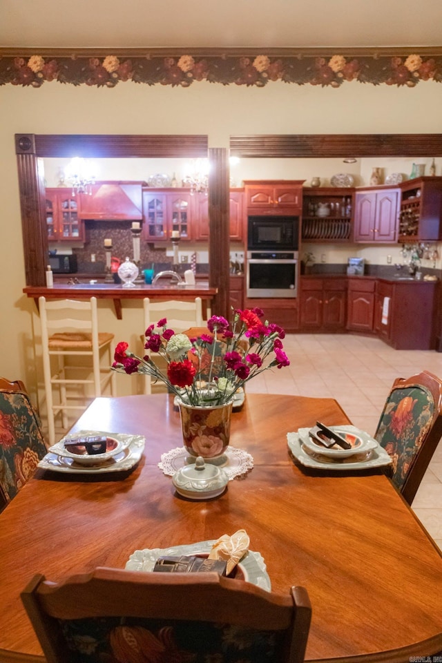 dining space featuring light tile patterned floors