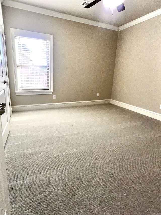 unfurnished room with carpet, ceiling fan, and ornamental molding