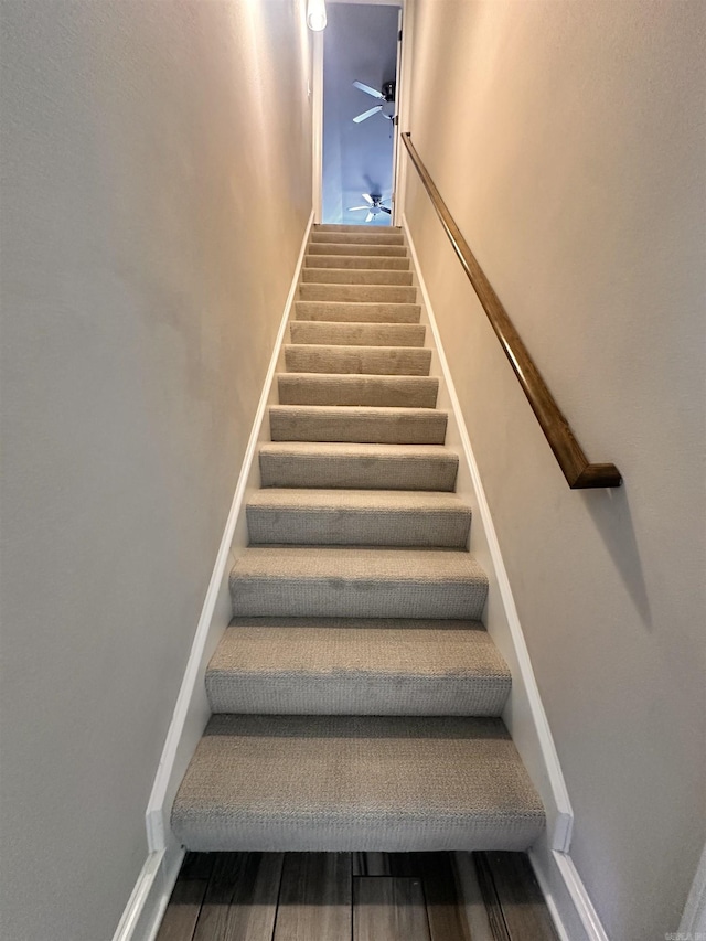 staircase with ceiling fan