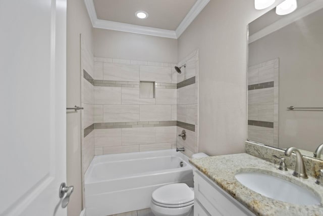 full bathroom with crown molding, vanity, tiled shower / bath combo, and toilet