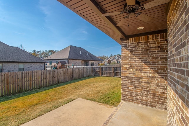 view of yard with a patio area and ceiling fan