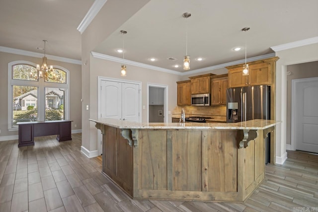 kitchen featuring a kitchen breakfast bar, a spacious island, a chandelier, and stainless steel appliances